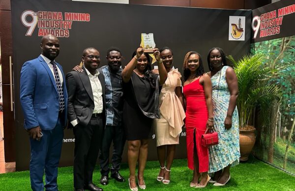 Lorraine Mac-Pods Lorraine Mac-Pods, Head, Mining and Metals – Stanbic Bank Ghana holding the award